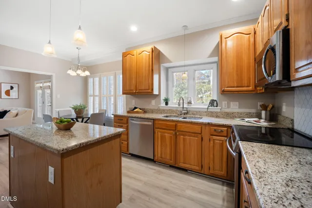a view of a dining room with furniture and window