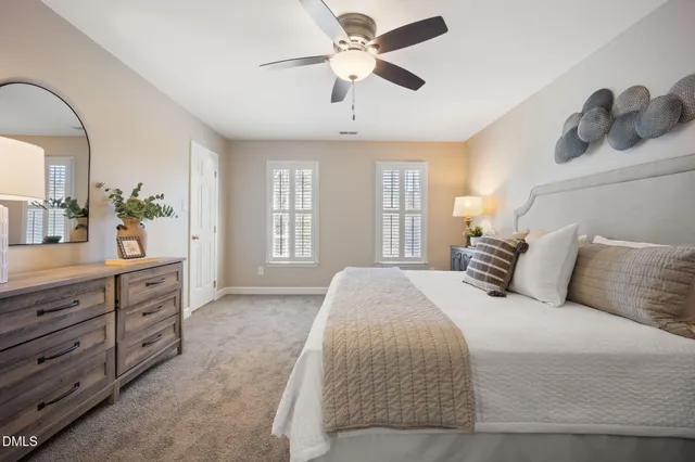 a spacious bathroom with a granite countertop sink and a large mirror
