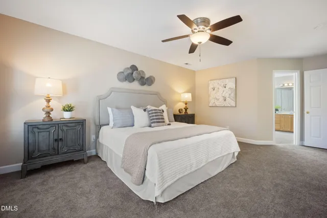 a bathroom with a tub sink and shower curtain
