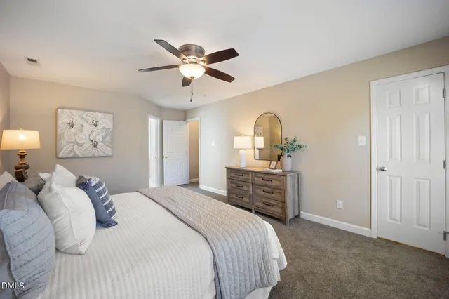 a kitchen with a window a sink and potted plant