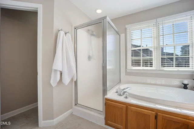 a bathroom with a sink vanity mirror and toilet