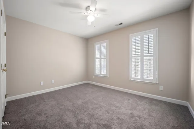 a view of a balcony with wooden floor and iron stairs