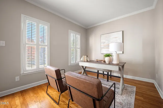 a dining room with furniture and wooden floor