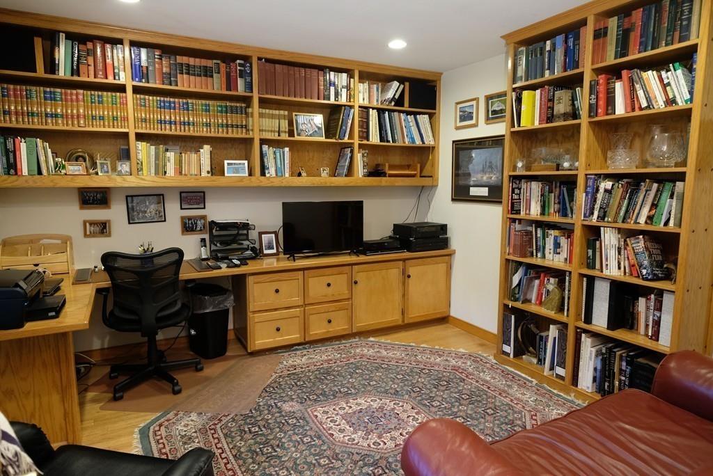 69 Piney Point Road Marion, MA 02738 - Photo 11 of 16 a view of a workspace with bookshelf