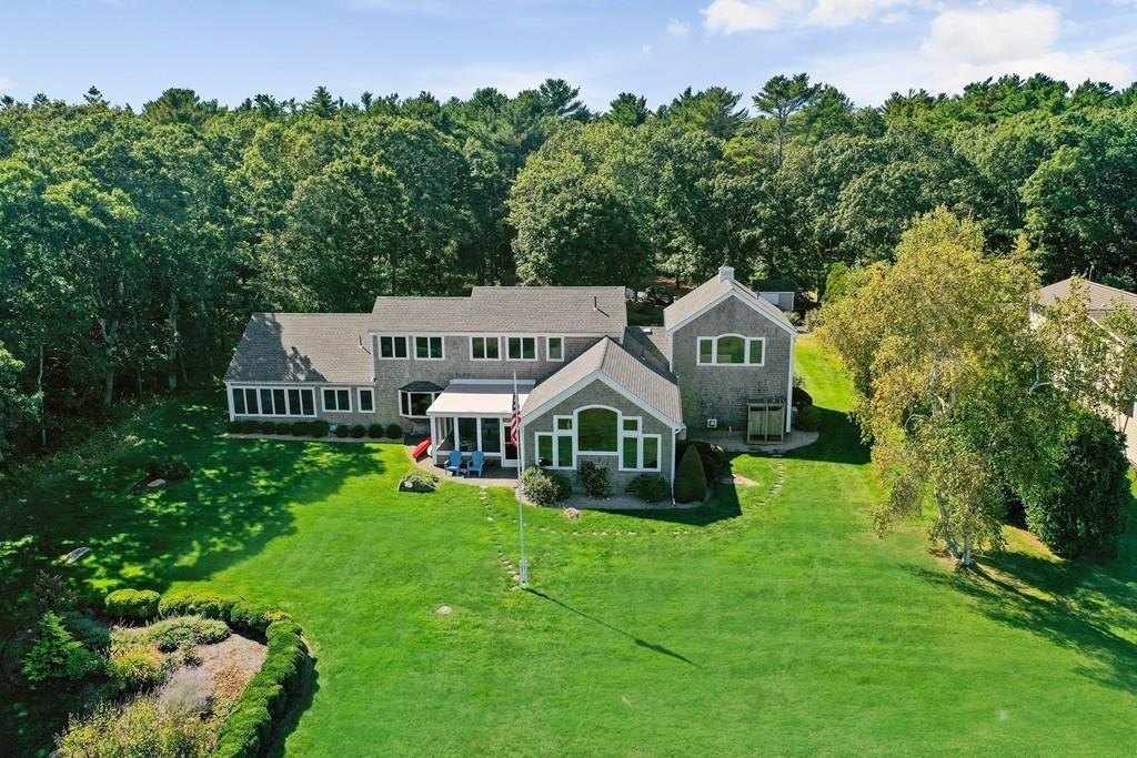 69 Piney Point Road Marion, MA 02738 - Photo 4 of 16 an aerial view of a house with garden space and trees