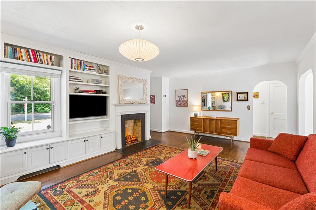 2494 Batavia Street Atlanta, GA 30344 - Photo 11 of 48 a living room with furniture a flat screen tv and a fireplace
