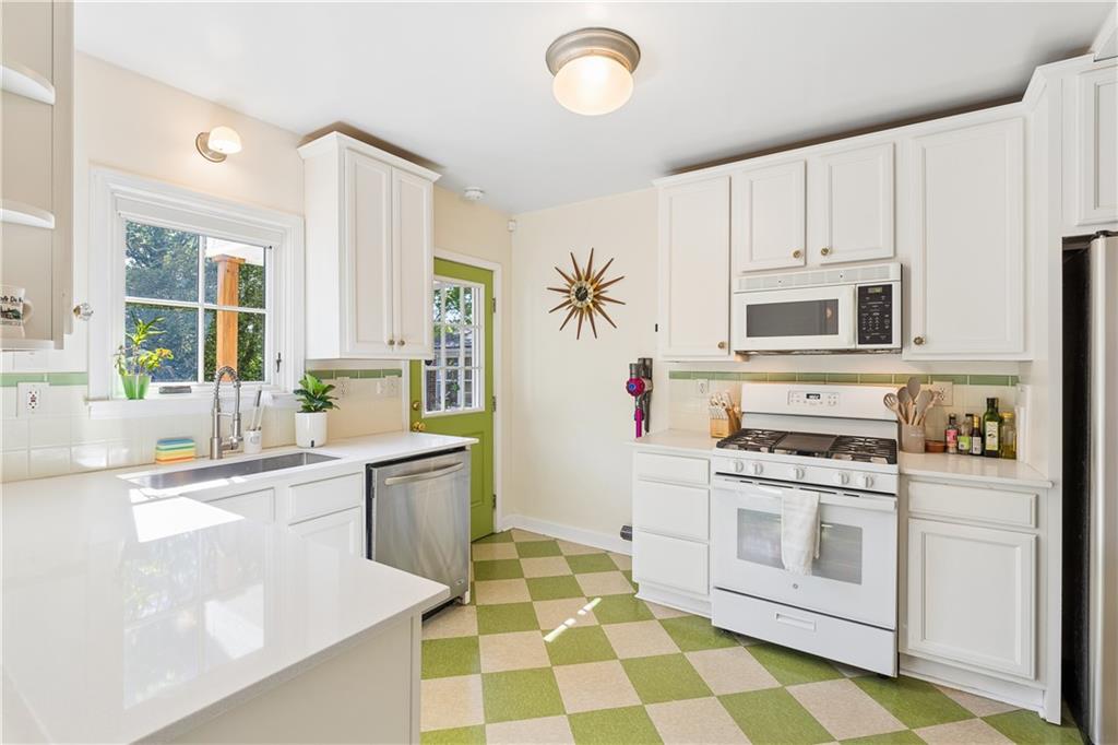 2494 Batavia Street Atlanta, GA 30344 - Photo 17 of 48 a kitchen with a stove a sink and a refrigerator
