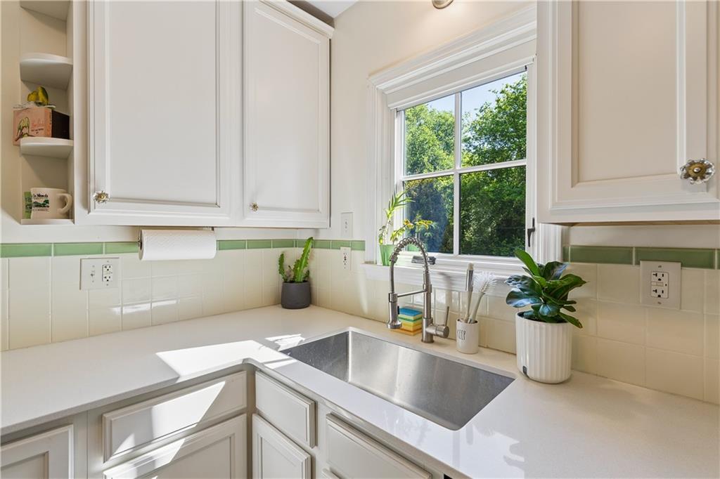 2494 Batavia Street Atlanta, GA 30344 - Photo 21 of 48 a kitchen with a sink and a potted plant