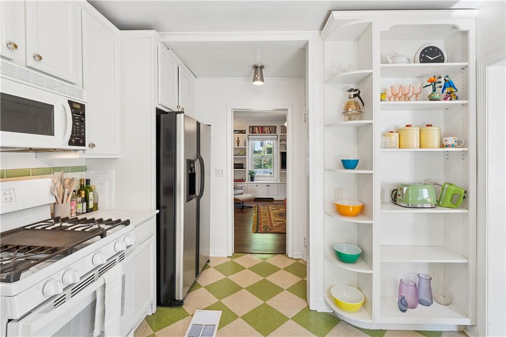 2494 Batavia Street Atlanta, GA 30344 - Photo 23 of 48 a kitchen with stainless steel appliances granite countertop a refrigerator and a stove top oven