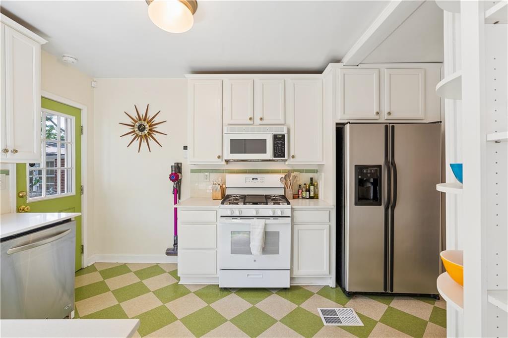 2494 Batavia Street Atlanta, GA 30344 - Photo 24 of 48 a kitchen with stainless steel appliances granite countertop a refrigerator and a stove