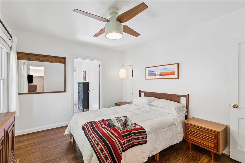 2494 Batavia Street Atlanta, GA 30344 - Photo 27 of 48 a bedroom with a bed and wooden floor