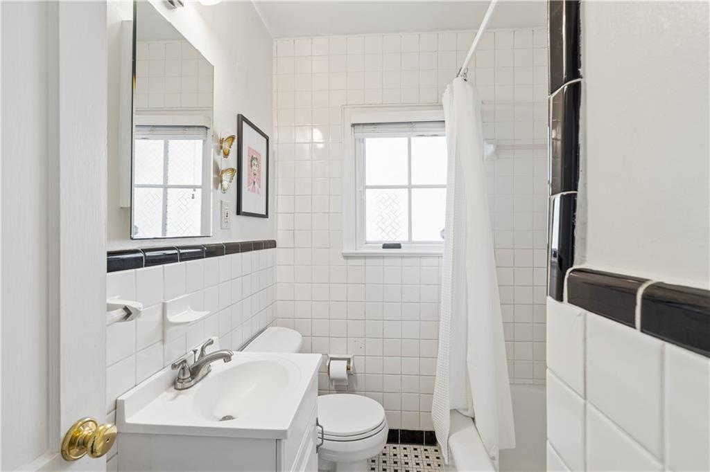 2494 Batavia Street Atlanta, GA 30344 - Photo 34 of 48 a bathroom with a toilet a sink and a mirror