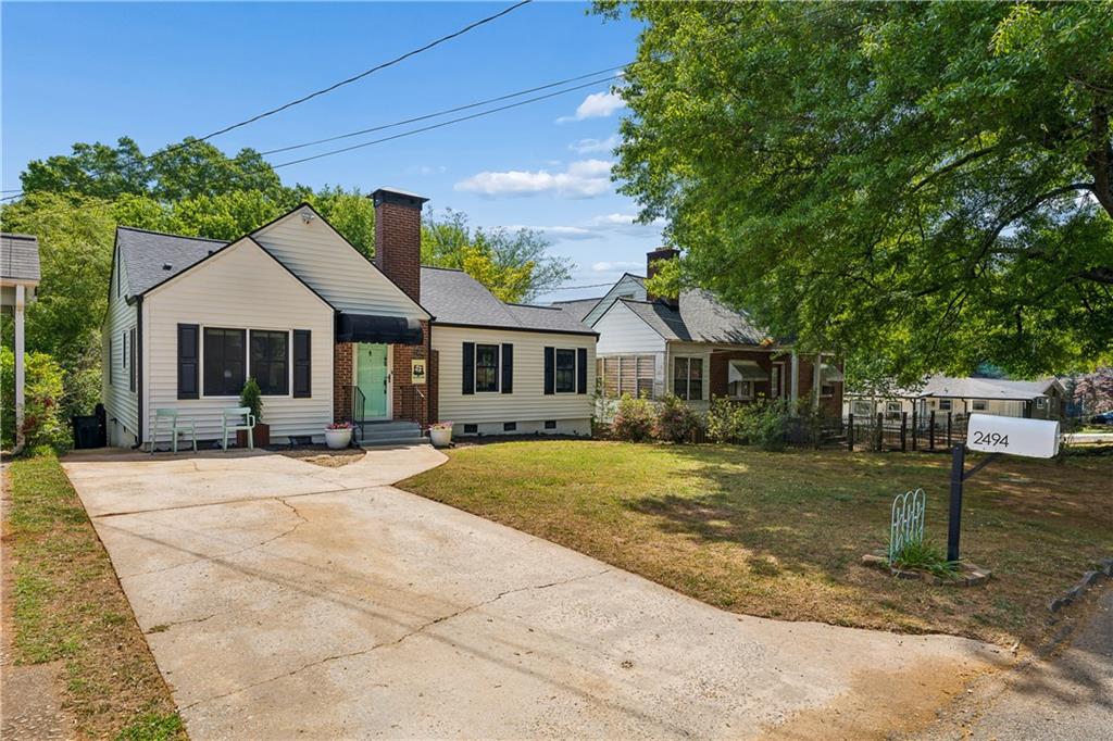 2494 Batavia Street Atlanta, GA 30344 - Photo 4 of 48 a front view of a house with a garden