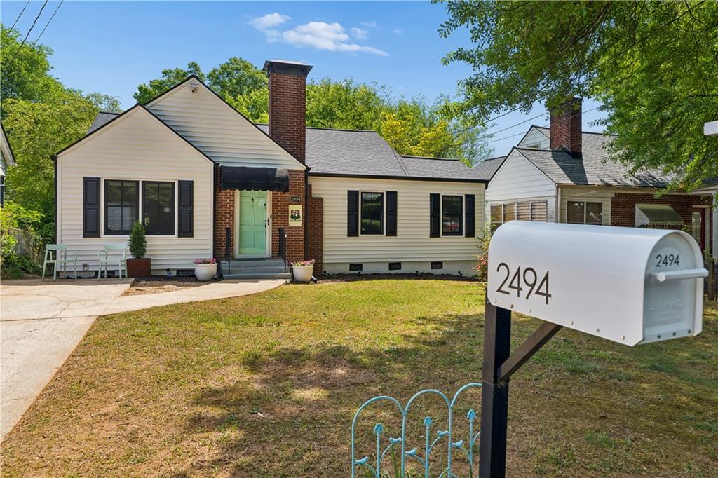 2494 Batavia Street Atlanta, GA 30344 - Photo 5 of 48 a front view of house with yard and trees in the background