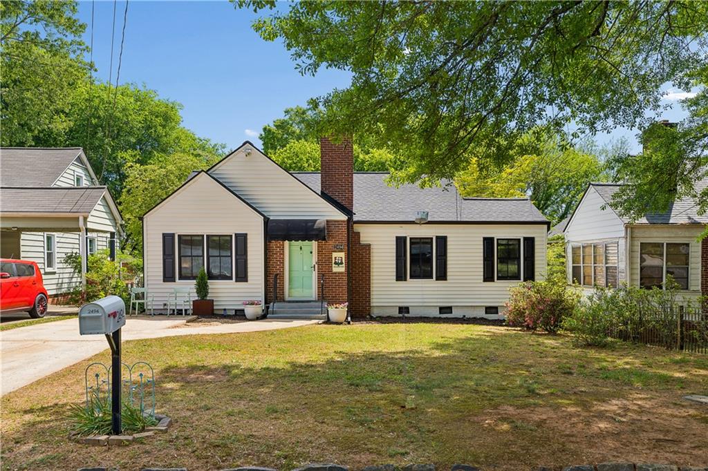 2494 Batavia Street Atlanta, GA 30344 - Photo 7 of 48 a front view of house with yard seating and green space
