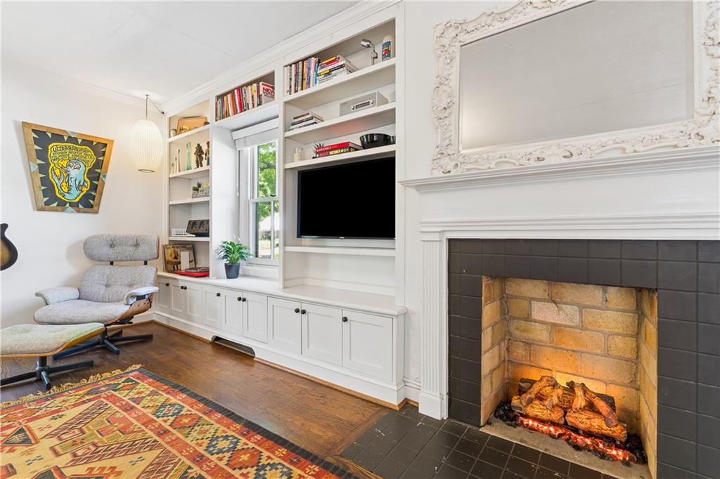 2494 Batavia Street Atlanta, GA 30344 - Photo 10 of 48 a living room with furniture a flat screen tv and a fireplace