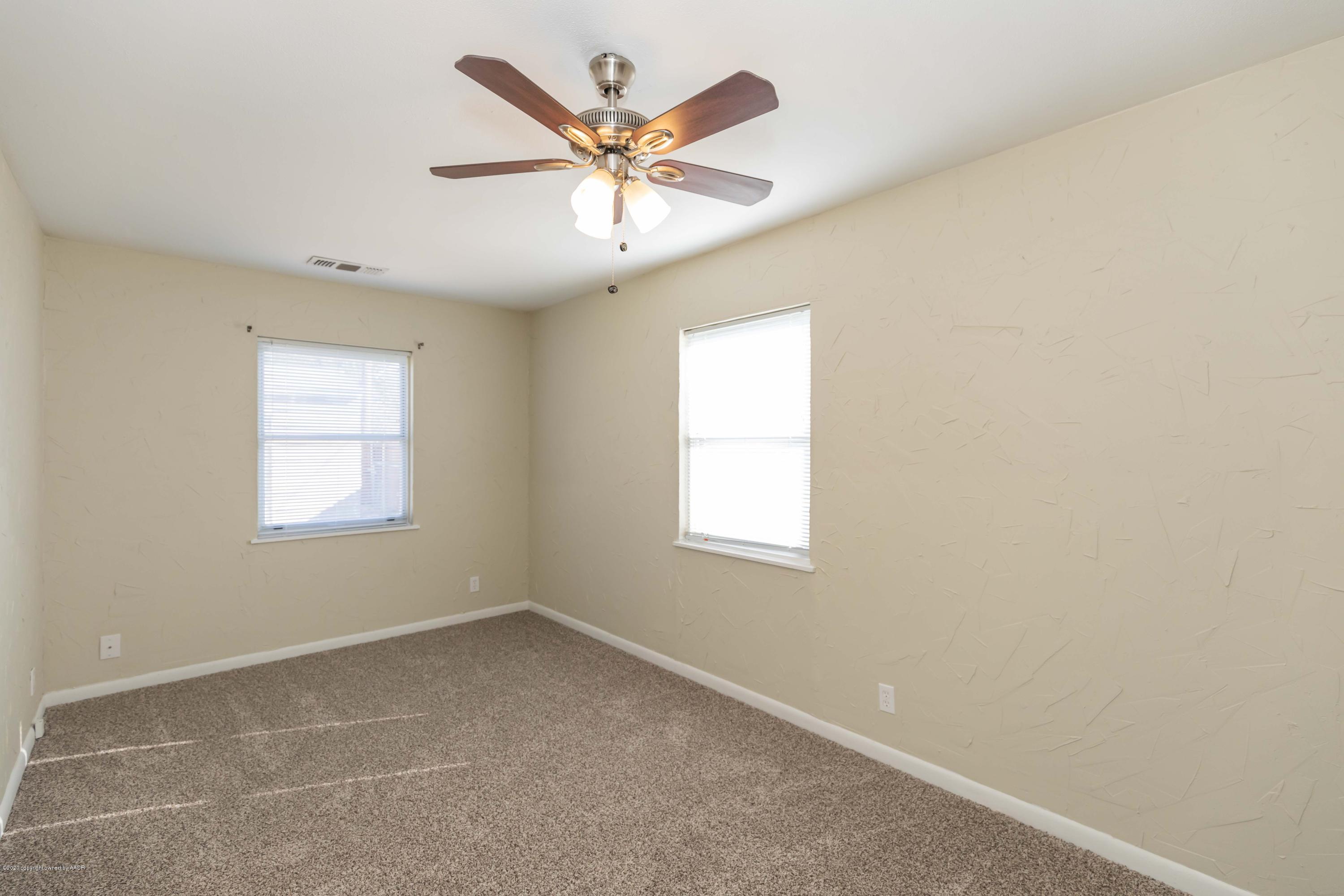 518 Southwest 45th Avenue Amarillo, TX 79110 - Photo 16 of 35 an empty room with a window and a fan