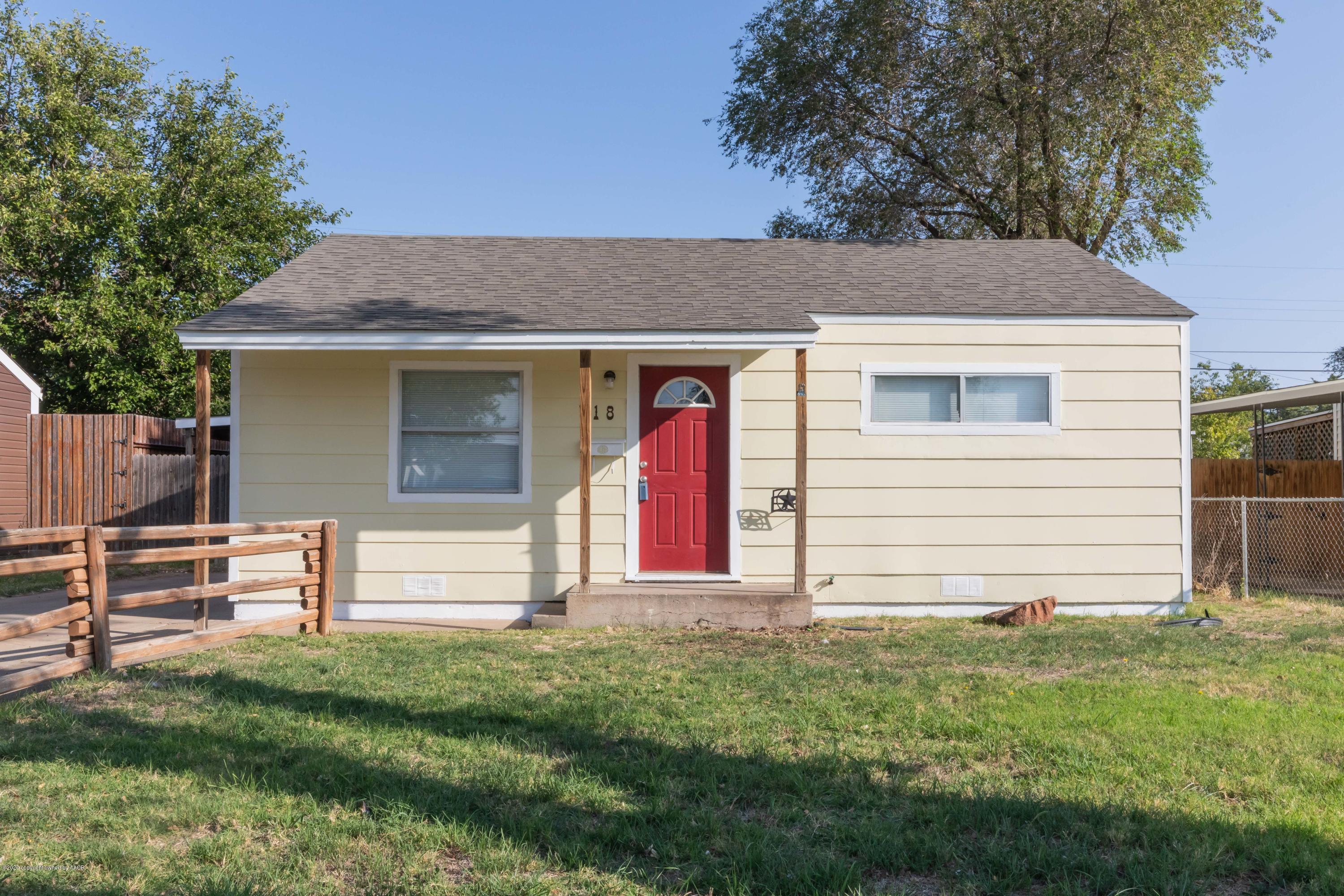 518 Southwest 45th Avenue Amarillo, TX 79110 - Photo 2 of 35 a front view of a house with a yard