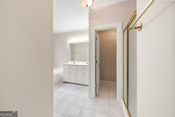 a bathroom with a sink a mirror and a shower