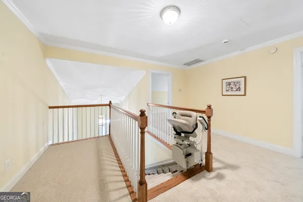 a view of a hallway with staircase