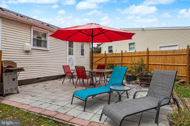 a view of a chairs and table in the patio