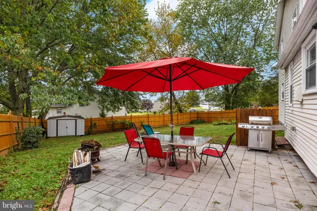 an outdoor space with furniture and umbrella