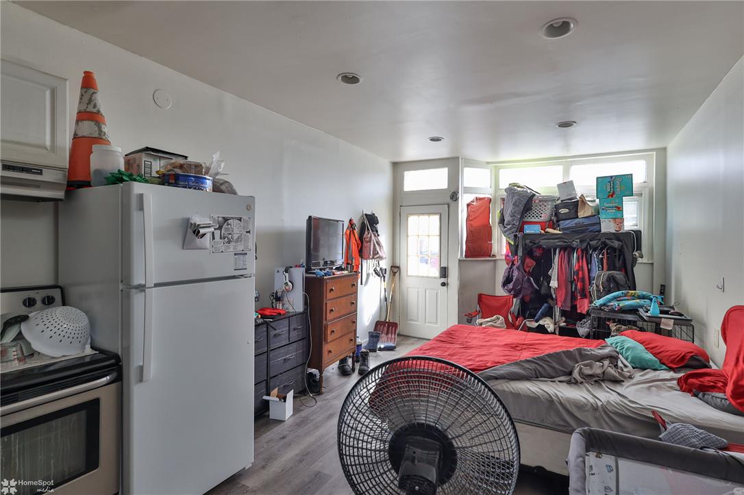 115 East Ruddle Street Coaldale, PA 18218 - Photo 7 of 57 Recessed lighting and durable wood-look flooring enhance this versatile living area with outdoor access.