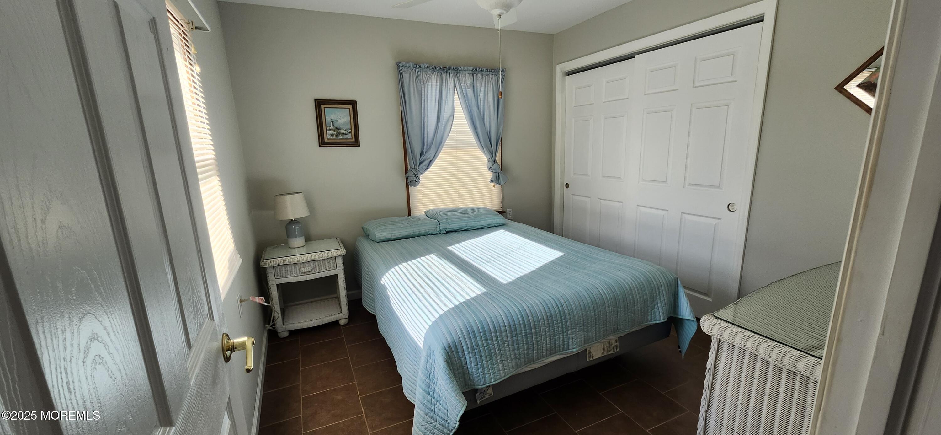 1045 Radio Road Little Egg Harbor, NJ 08087 - Photo 11 of 16 a bedroom with a bed and a window
