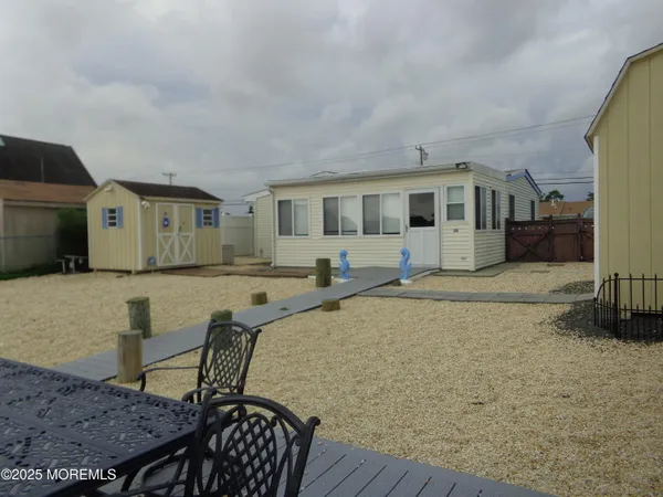 a bathroom with a sink mirror vanity and toilet