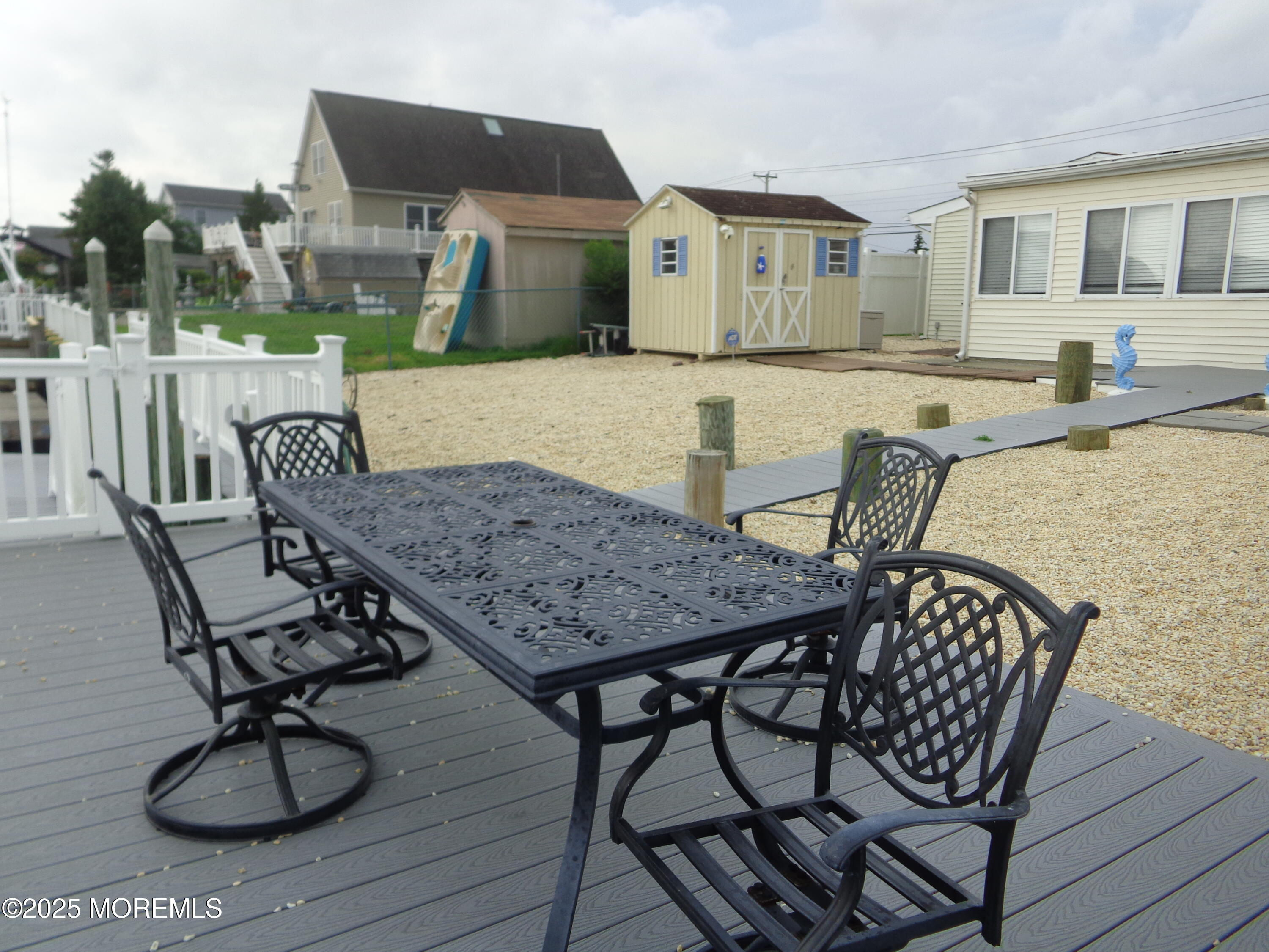 1045 Radio Road Little Egg Harbor, NJ 08087 - Photo 16 of 16 a view of a dinning table and chairs in the patio