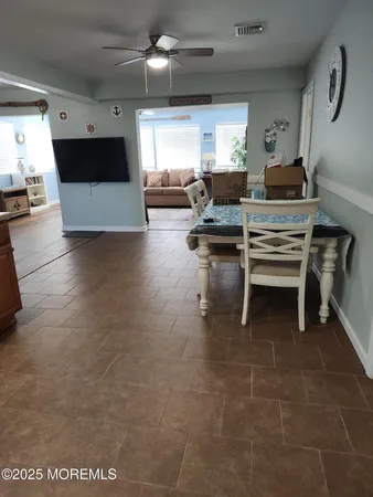 a kitchen with a stove a sink and a refrigerator