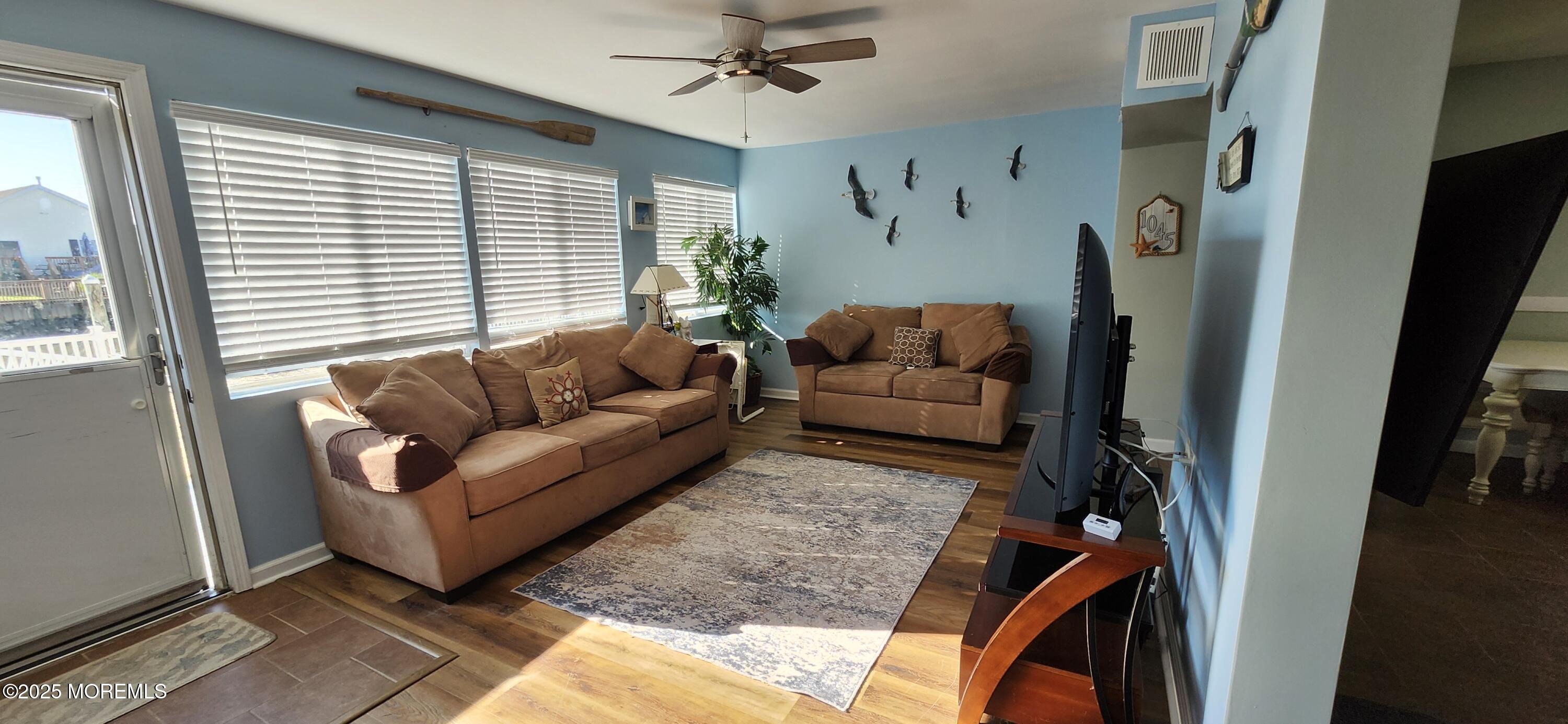 1045 Radio Road Little Egg Harbor, NJ 08087 - Photo 8 of 16 a living room with furniture and a large window