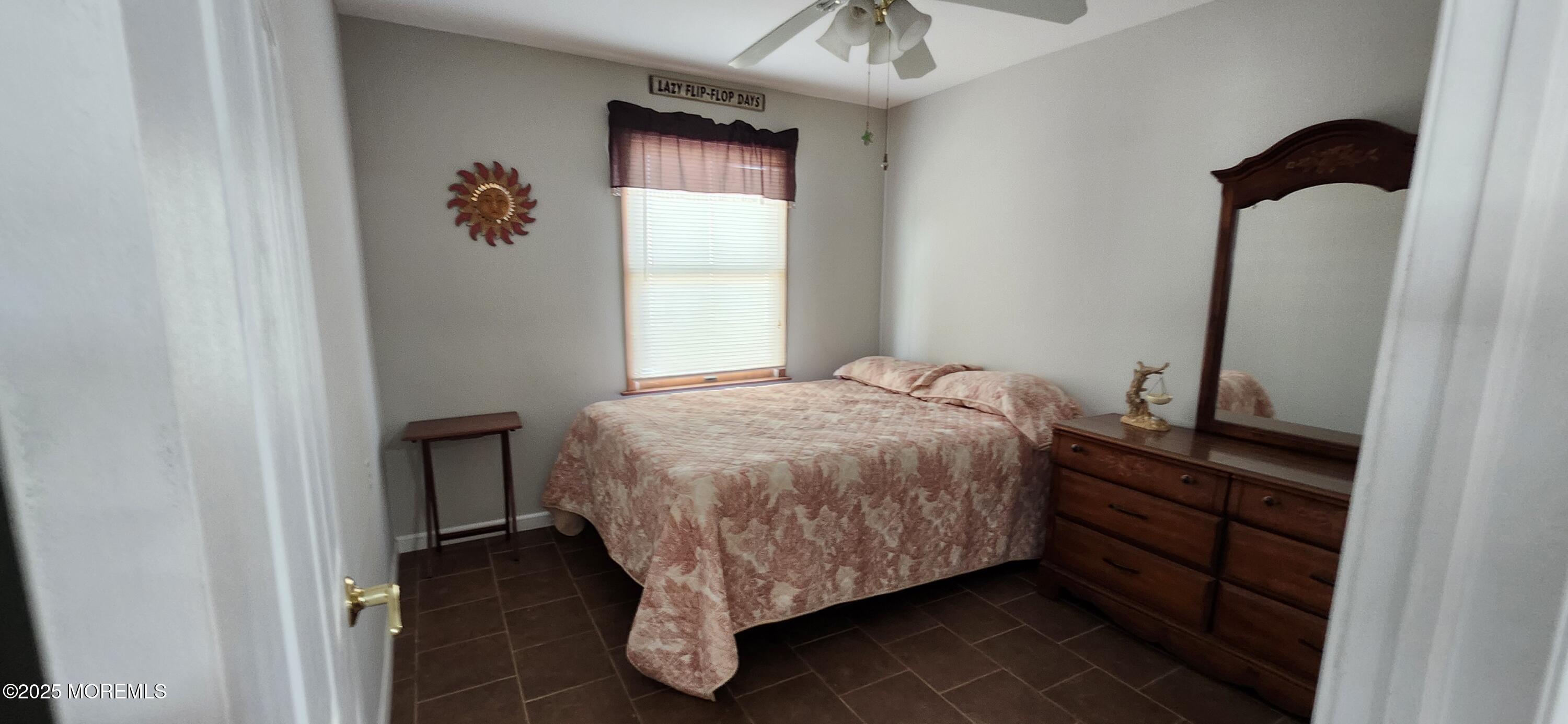 1045 Radio Road Little Egg Harbor, NJ 08087 - Photo 10 of 16 a bedroom with a bed and a window