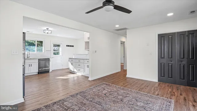 a view interior of a house and an empty room with a kitchen
