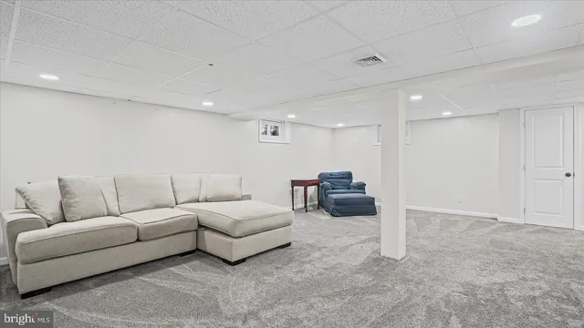 a living room with furniture and a couch