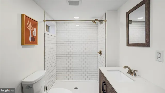 a bathroom with a sink and shower