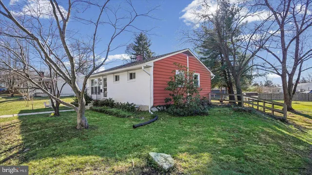 a view of a backyard with large trees
