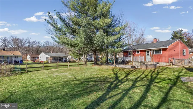 a front view of house with yard and trees