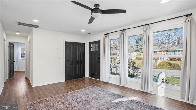 a view of entryway with wooden floor