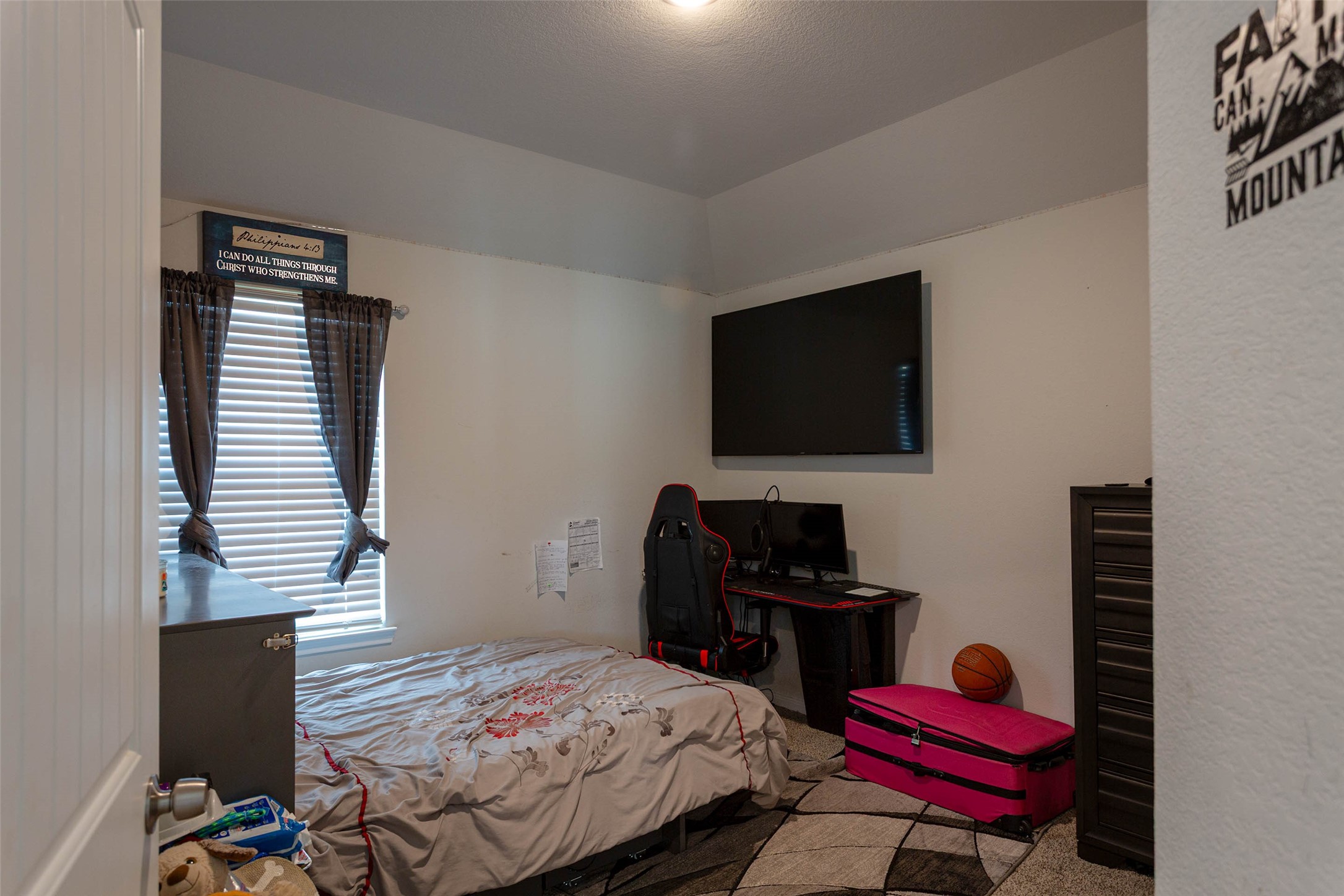 14212 Shasta Ridge Drive Conroe, TX 77303 - Photo 12 of 21 a bedroom with a bed computer on desk and a chair
