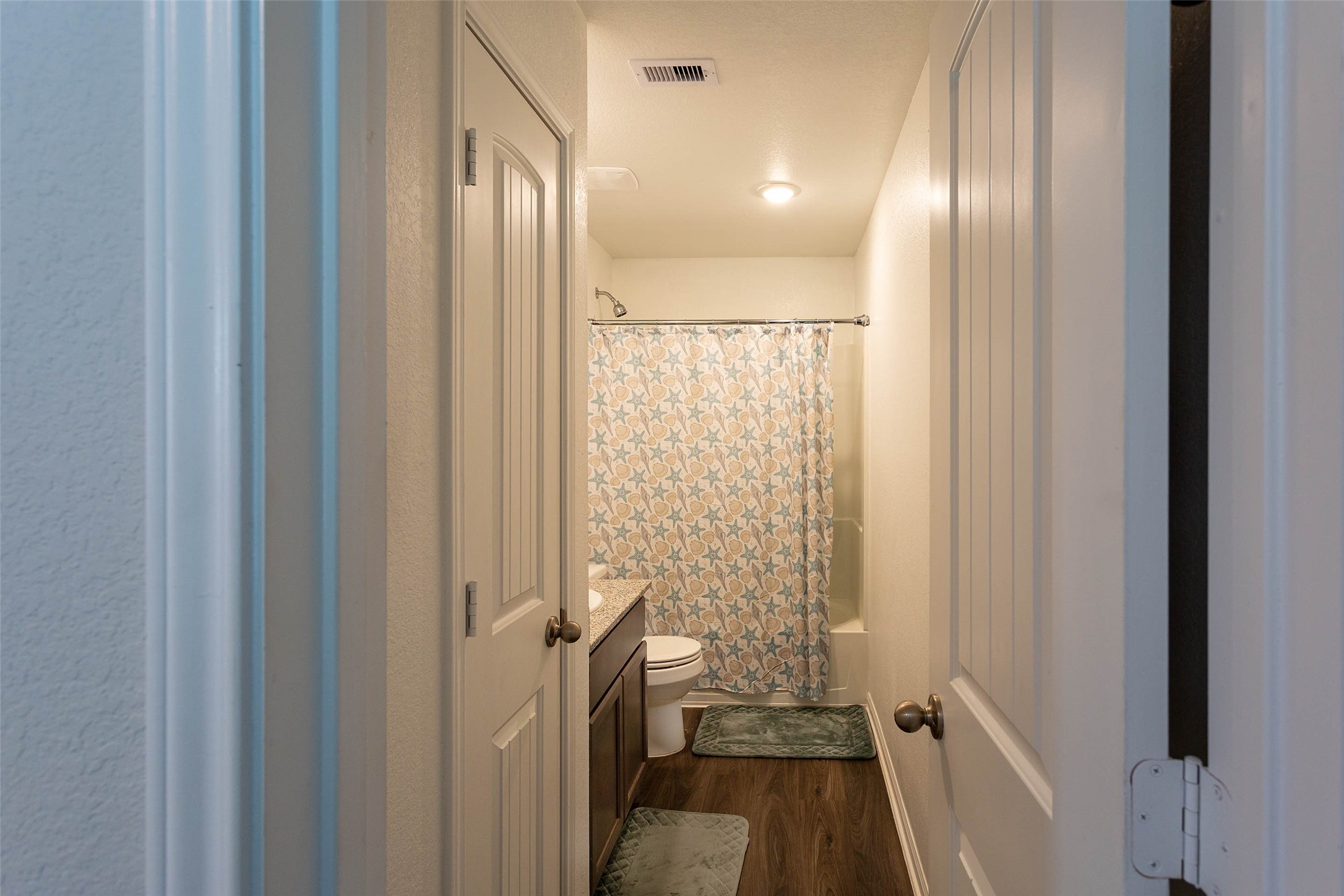 14212 Shasta Ridge Drive Conroe, TX 77303 - Photo 14 of 21 a bathroom with a glass door shower and a sink