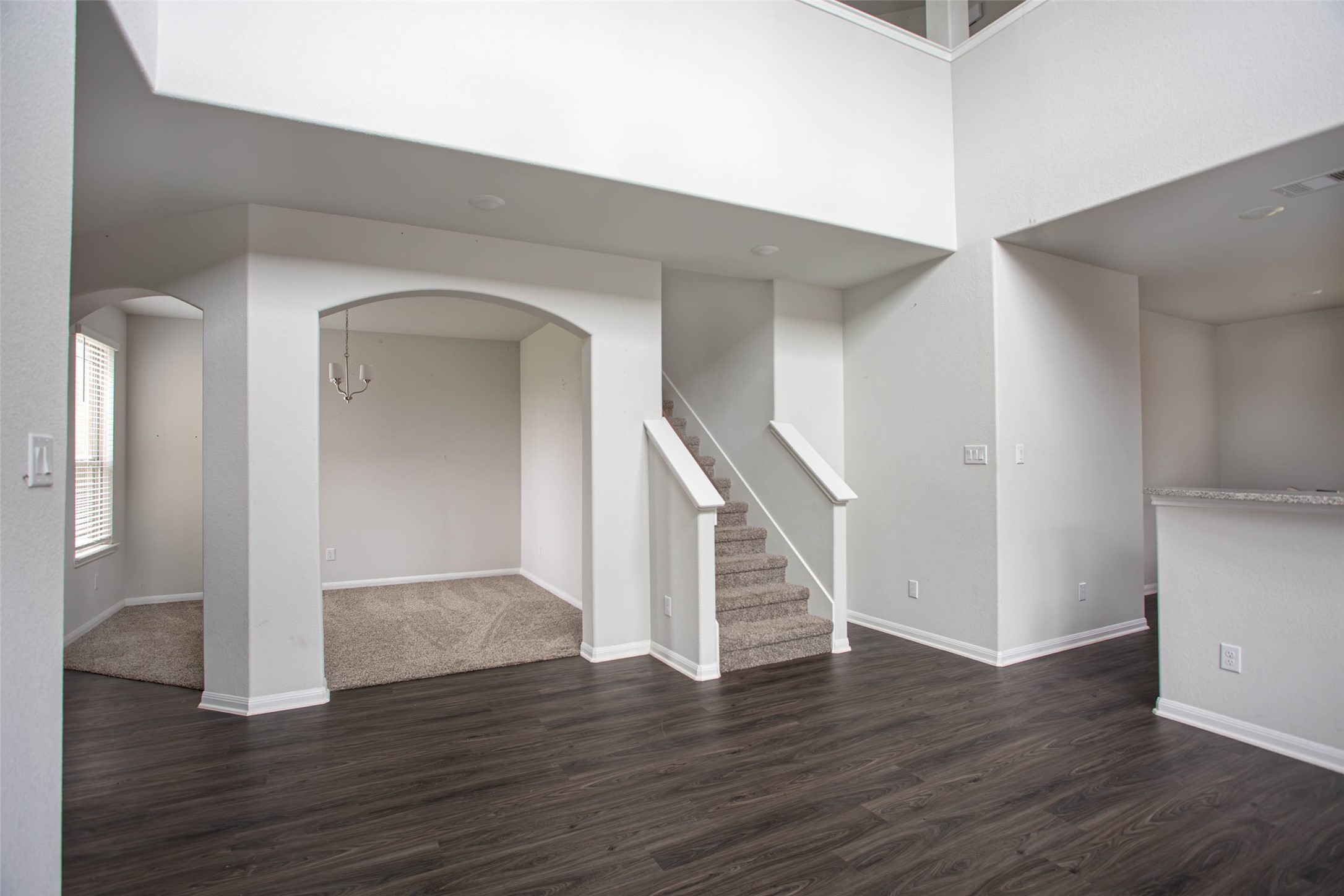 14212 Shasta Ridge Drive Conroe, TX 77303 - Photo 3 of 21 an empty room with wooden floor and entryway