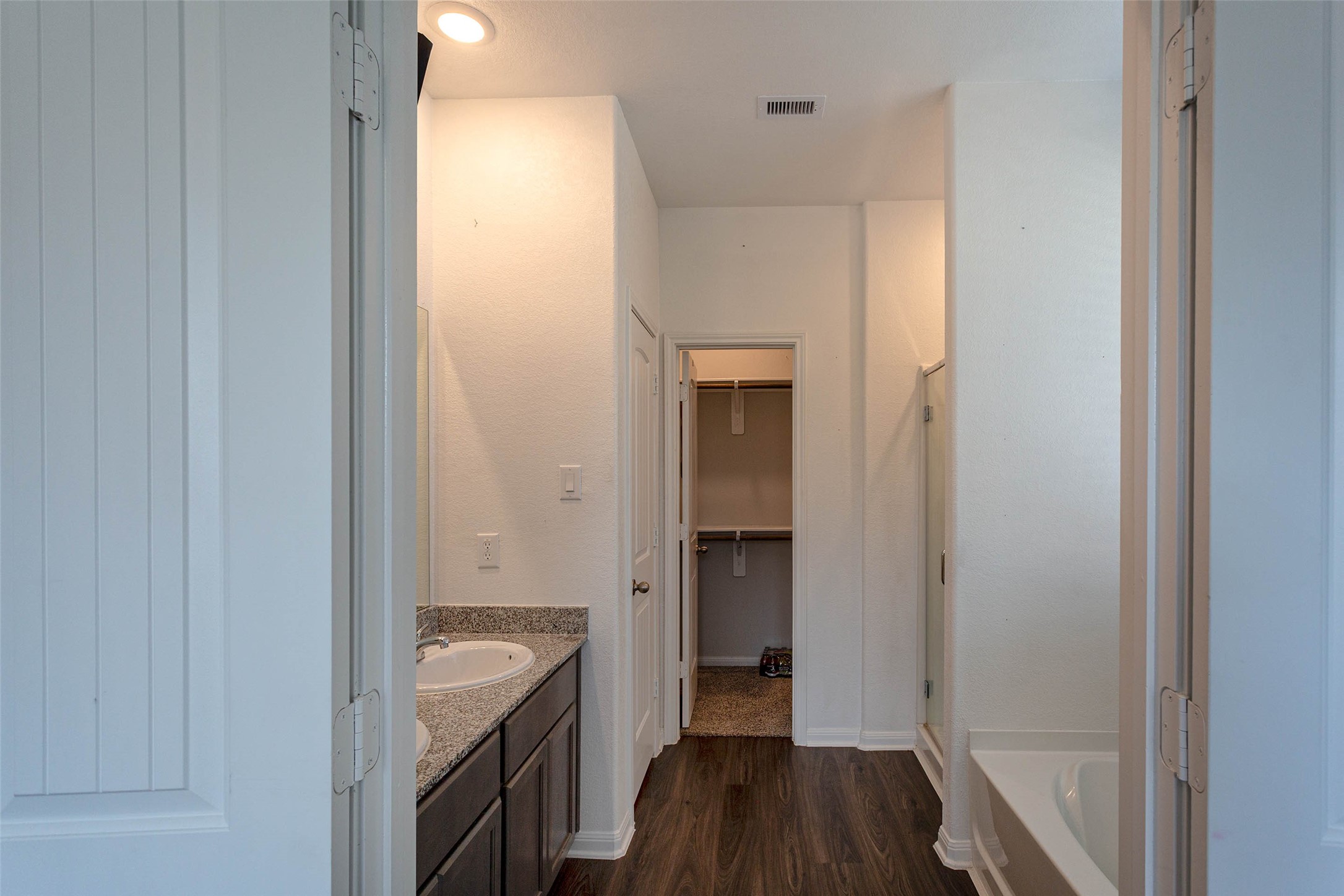 14212 Shasta Ridge Drive Conroe, TX 77303 - Photo 9 of 21 a bathroom with a sink and a mirror
