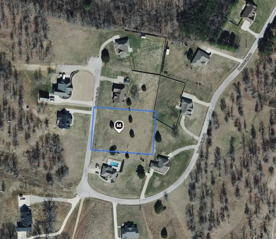 an aerial view of a house with outdoor space