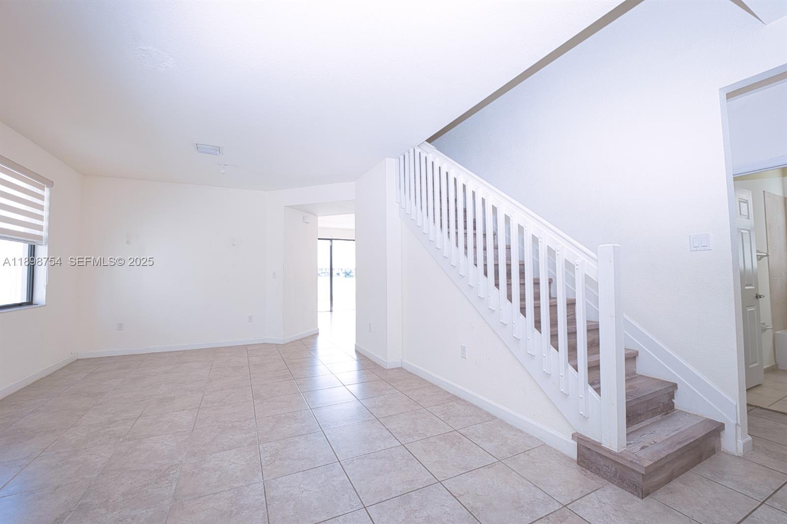 3412 West 103rd Terrace Hialeah, FL 33018 - Photo 18 of 44 a view of an entryway with staircase