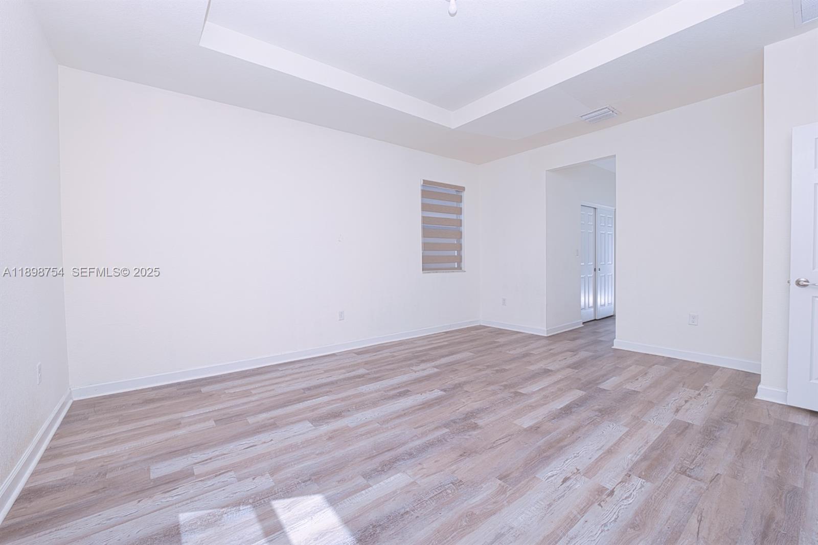 3412 West 103rd Terrace Hialeah, FL 33018 - Photo 22 of 44 wooden floor in a empty room