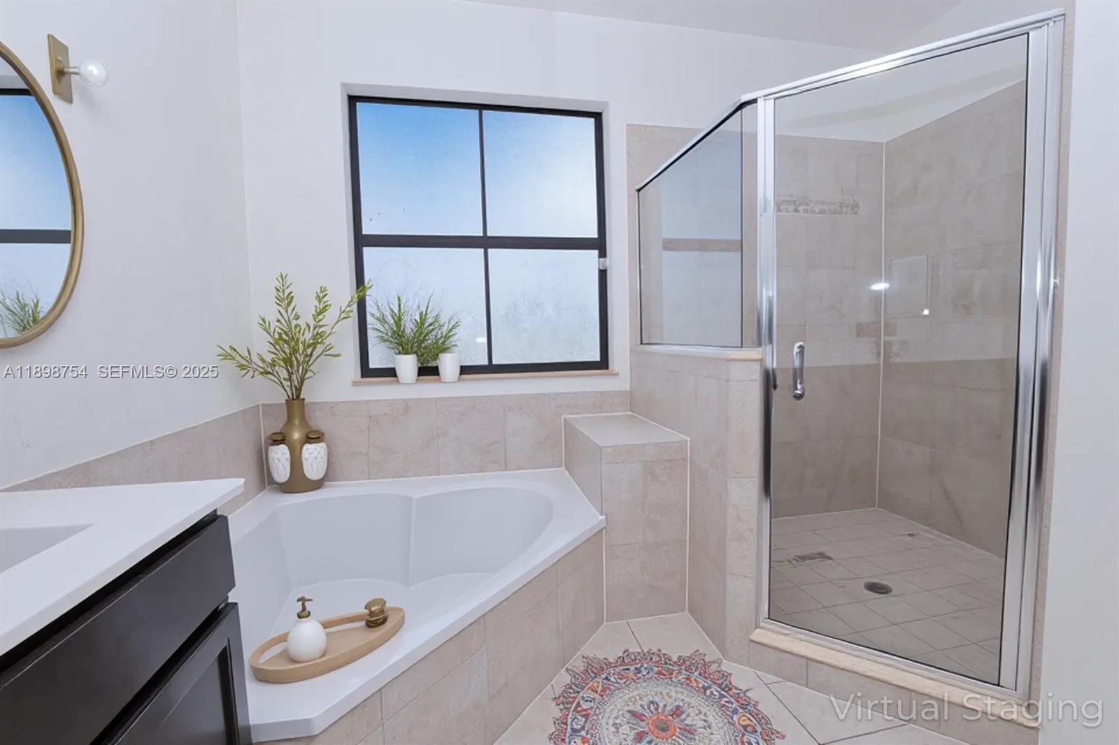 3412 West 103rd Terrace Hialeah, FL 33018 - Photo 27 of 44 a bathroom with a tub shower and mirror