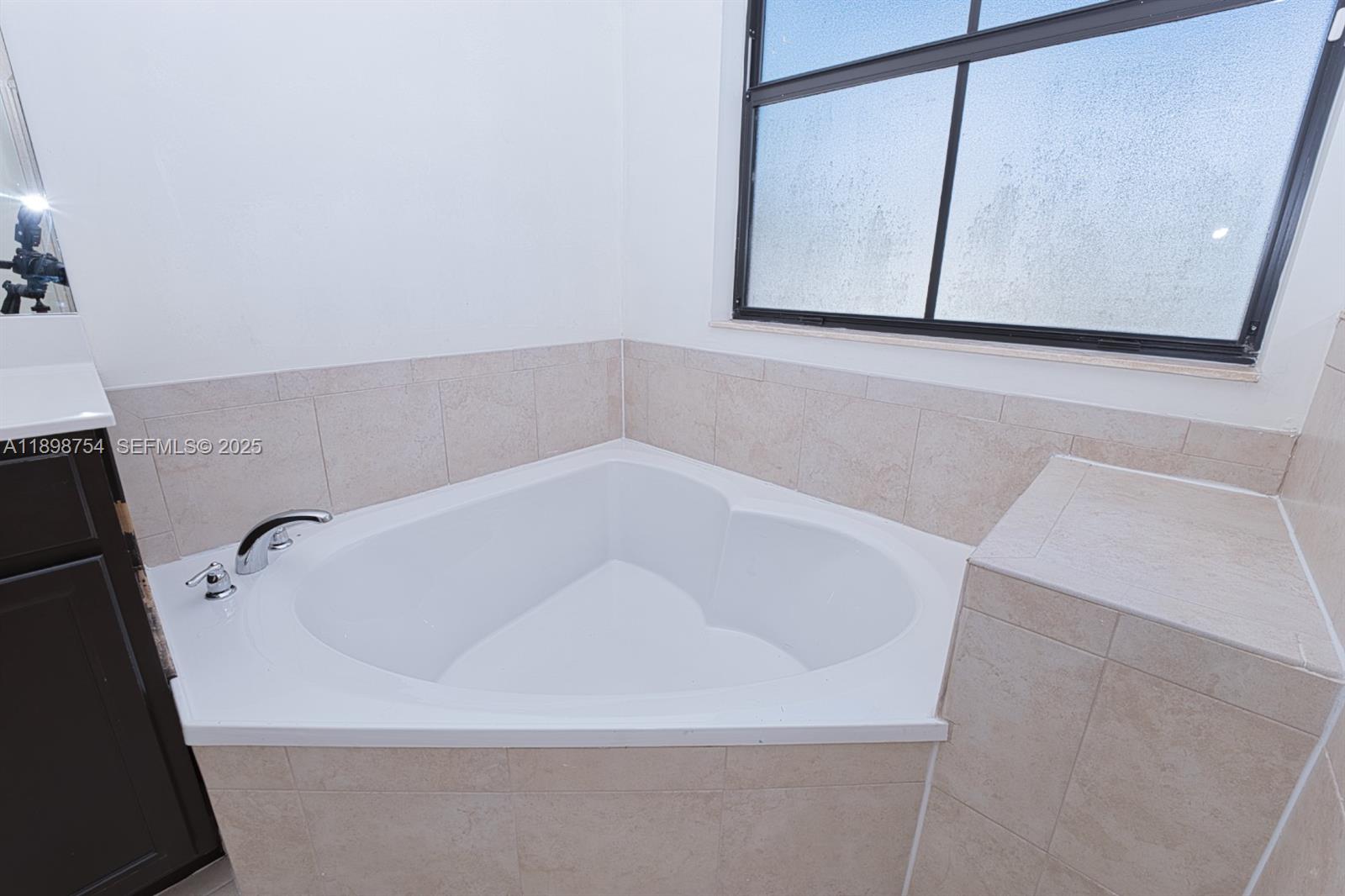 3412 West 103rd Terrace Hialeah, FL 33018 - Photo 29 of 44 a bathroom with a bathtub