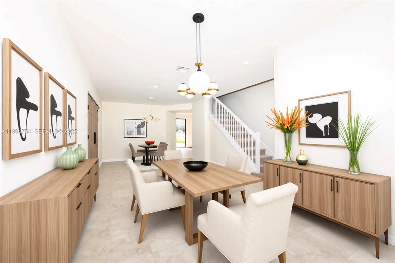 3412 West 103rd Terrace Hialeah, FL 33018 - Photo 3 of 44 a living room with furniture and a window