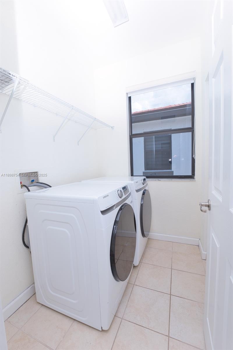 3412 West 103rd Terrace Hialeah, FL 33018 - Photo 39 of 44 a utility room with dryer and washer